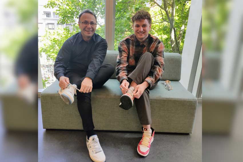 Two people trying on shoes with new shoelace called 'woo-lace'. 