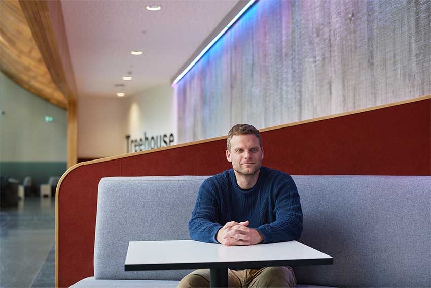 AUT academic Mangor Pederson sitting at AUT City Campus.