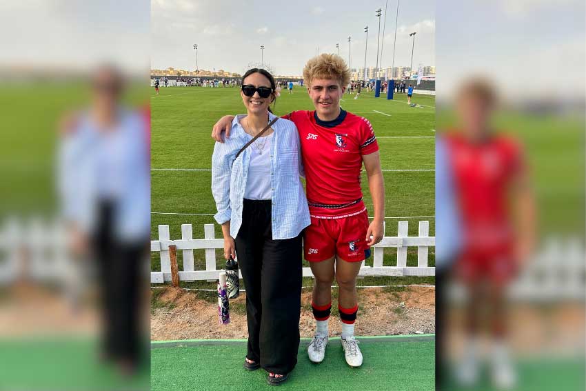 Chanae Ihimaera standing with her son Koupa Nomotu on Rugby Field. 