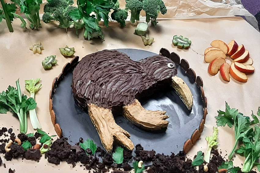 A cake shaped like a bird