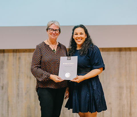 Selena Volodzskis accepting an award